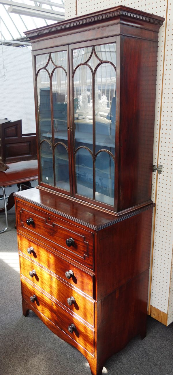 A George III mahogany secretaire bookcase, the associated top with a pair of astragal glazed doors over fitted drawer and three further long drawers,