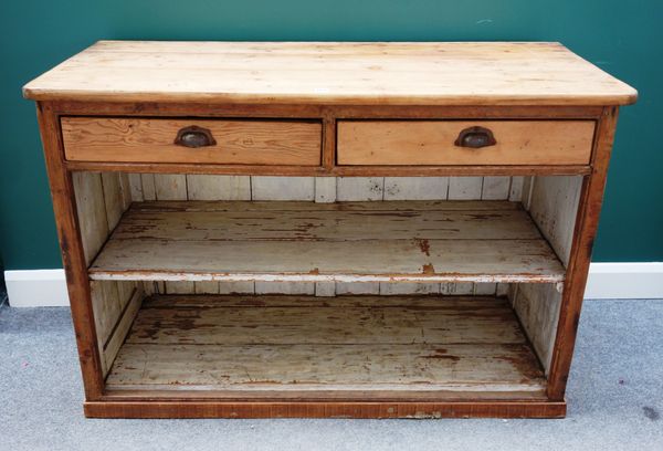 A 19th century pine dresser base, with pair of drawers over open shelves, 143cm wide x 99cm high.