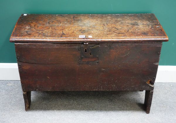 An early 17th century oak five plank coffer, with chip work decoration, on slab supports, 86cm wide x 33cm deep.