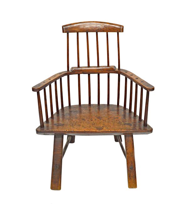 A late 18th century primitive oak stick back chair, with three piece back and solid seat, on staked supports, 80cm wide x 105cm high.   Illustrated