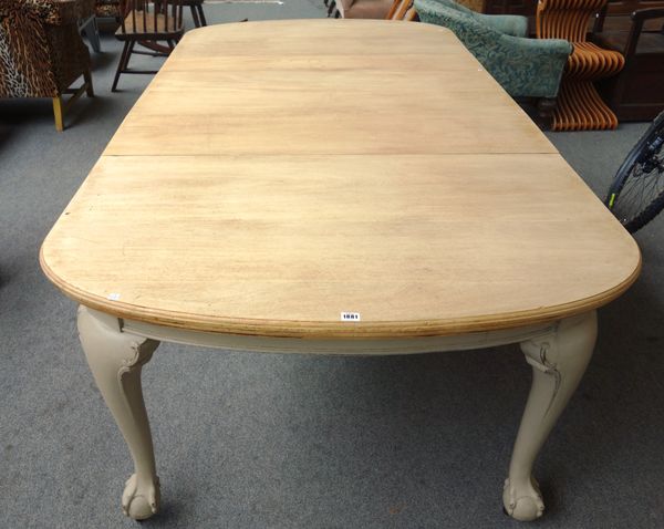 A late 19th century dining table, with bleached mahogany top on claw and ball feet, to include three extra leaves, 122cm wide x 141cm long x 240cm lon