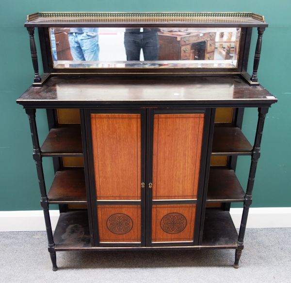 A late Victorian Aesthetic Movement ebonised and parcel gilt side cabinet, with mirrored raised back above pair of fruitwood doors with incised Japane