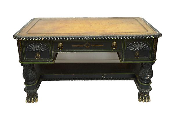 Possibly American Regency Revival; a free standing writing desk with rounded rectangular top over five frieze drawers and matching verso, on four spir