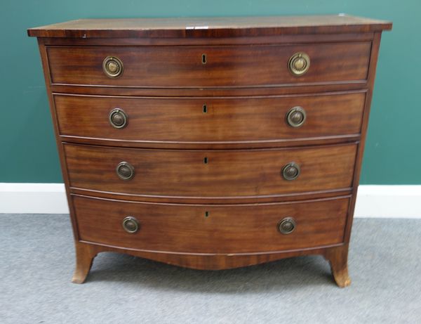 A Regency inlaid mahogany bowfront chest of four long graduated drawers, on splayed bracket feet, 95cm wide x 52cm deep.