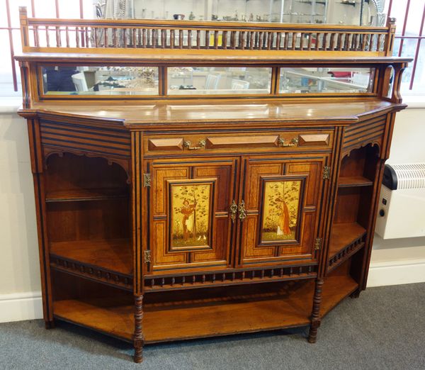 After Bruce Talbert; a Victorian mahogany, ebonised and painted cabinet, the mirror panelled raised back above breakfront base, with single drawer abo