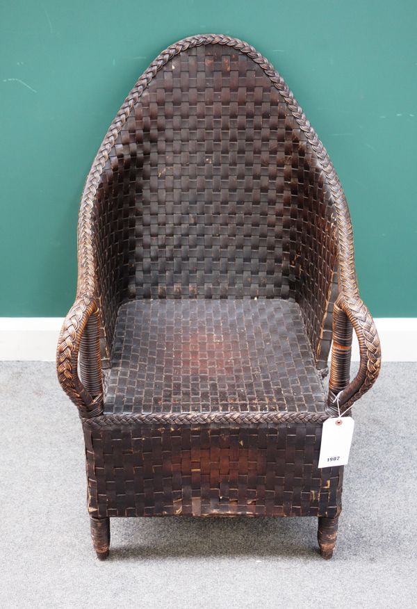 An early 20th century wicker and laminated paper lancet back armchair, in the manner of the Dryad Workshop, 55cm wide x 96cm high.