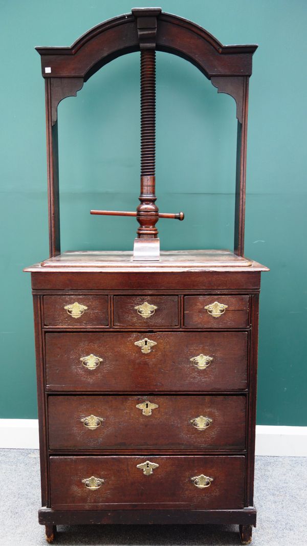 An 18th century oak book press chest, the screw top over three short and three long drawers, on stile feet, 80cm wide x 184cm high.