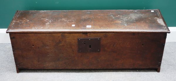 A 17th century oak five plank coffer, carved 'WF 1656' to the lid, 112cm wide x 33cm deep.