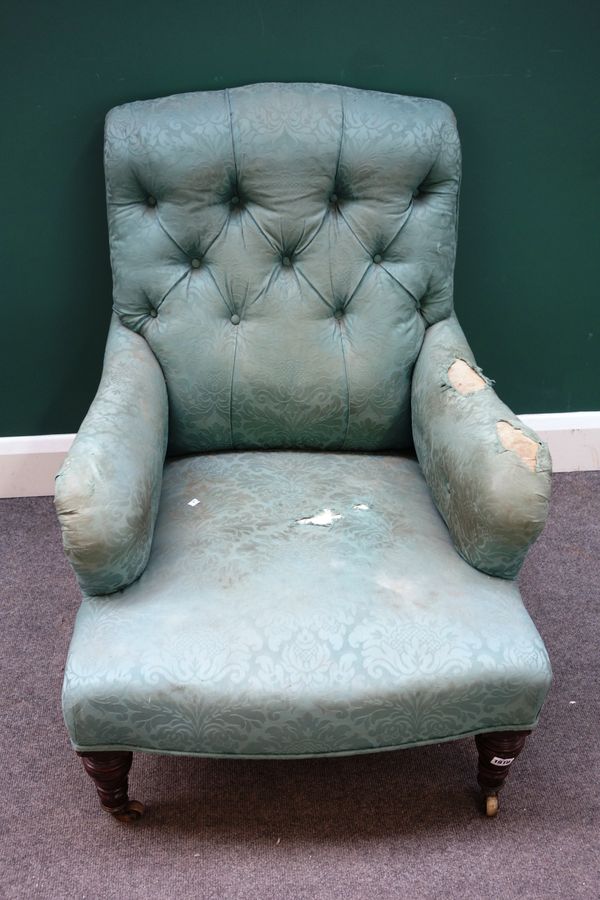 A Victorian mahogany framed teal floral upholstered low deep armchair in the Howard style, on ring turned tapering legs, stamped '2895' to rear leg, 6