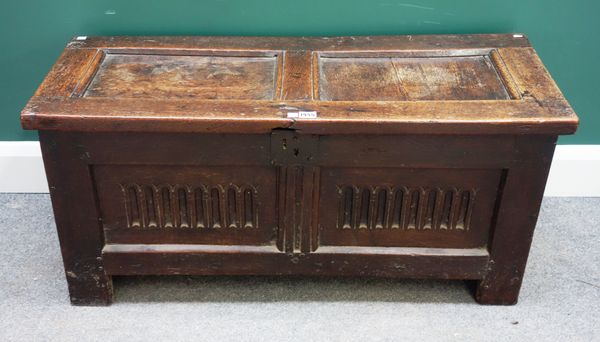 A small 17th century oak coffer, with double panel lid and front, on stile feet, 100cm wide x 40cm deep.