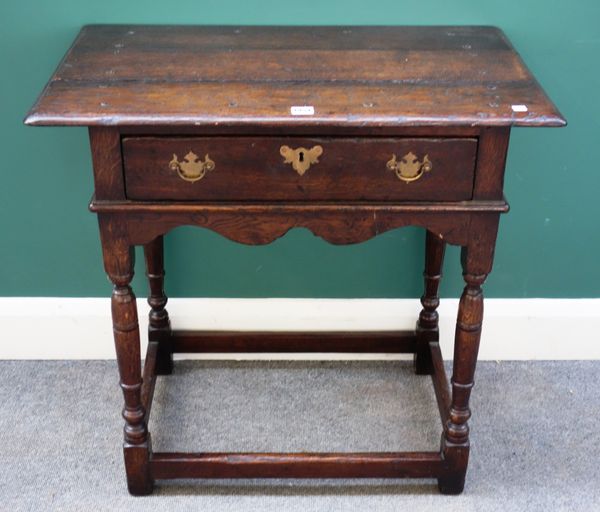 A 17th century style oak single drawer side table on turned supports, 77cm wide x 46cm deep.