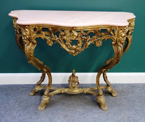 An 18th century style console table, the serpentine marble top on an acanthus cast and pierced gilt brass base, with four 'S' scroll supports, 103cm w