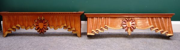 A set of five 20th century parcel gilt walnut pelmets, with carved faux linen fold decoration, two 103cm wide, one 124cm wide, two 150cm wide (5).