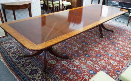 A George III style satinwood banded mahogany 'D' end extending dining table, on eight downswept supports, two include two extra leaves, 117cm wide x 1