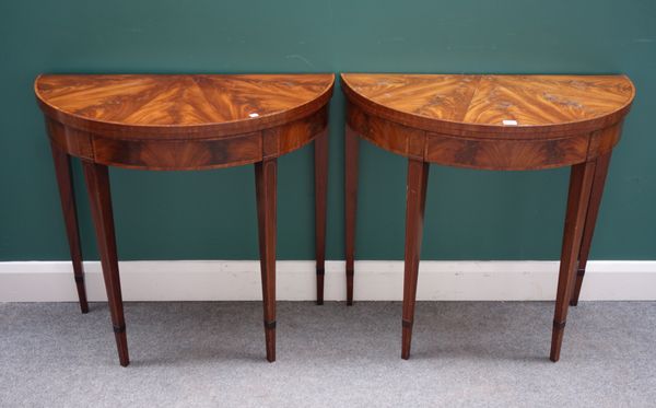 A pair of George III style inlaid mahogany demi lune card tables, on tapering square supports, 84cm wide x 43cm deep.