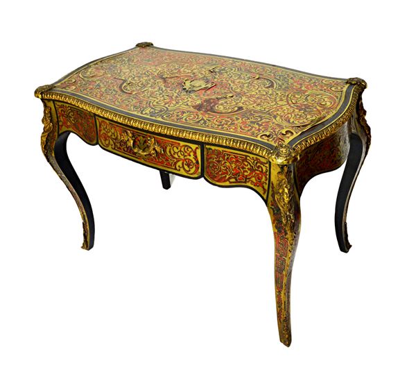 A 19th century gilt metal mounted boulle work single drawer bureau plat, on cabriole supports, 112cm wide x 63cm deep.   Illustrated