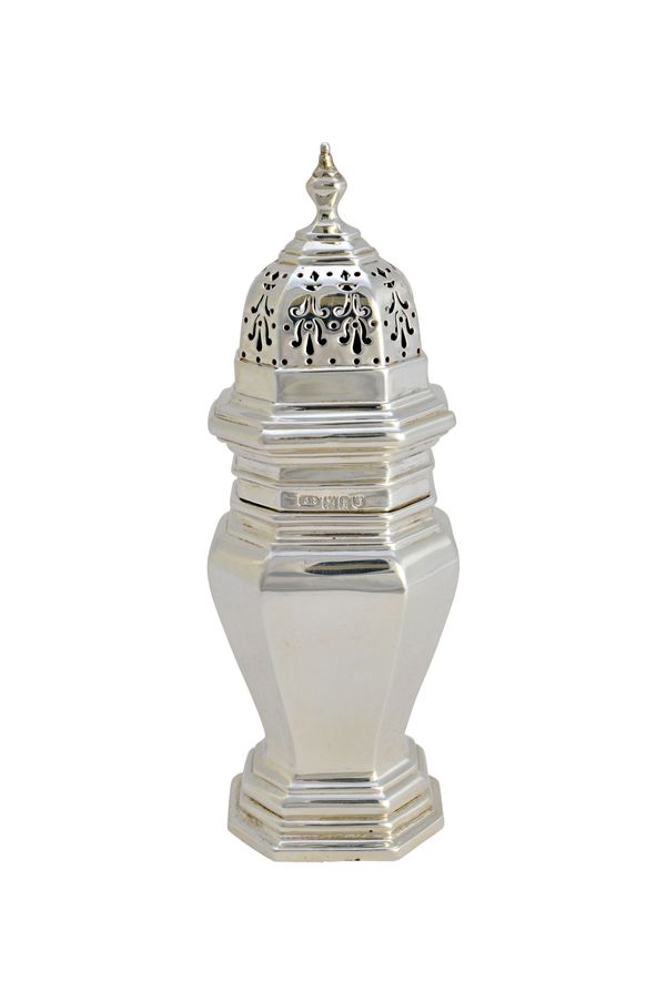 A silver sugar caster, of octagonal baluster form, in the 18th century taste, height 20.5 cms, London 1914, weight 233 gms.   Illustrated