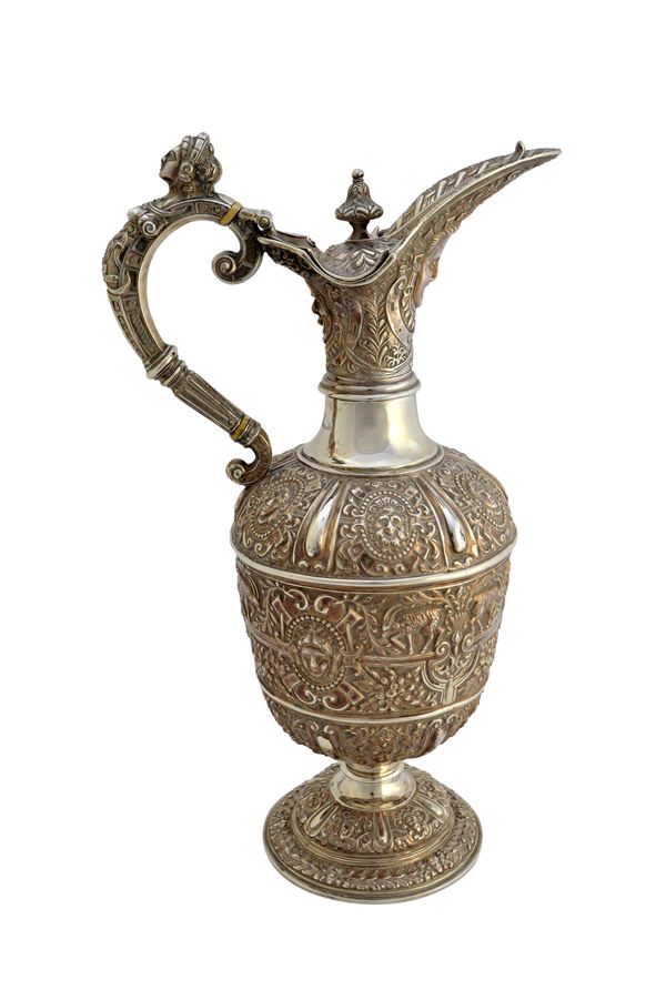 A Victorian silver Cellini pattern claret jug, decorated with classical masks and animals, after the antique, with a classical female mask to the hand