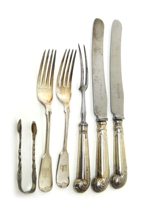 Silver and silver mounted table flatware, comprising, two fiddle pattern table forks, Sheffield 1907, a pair of sugar tongs, a steel twin pronged fork