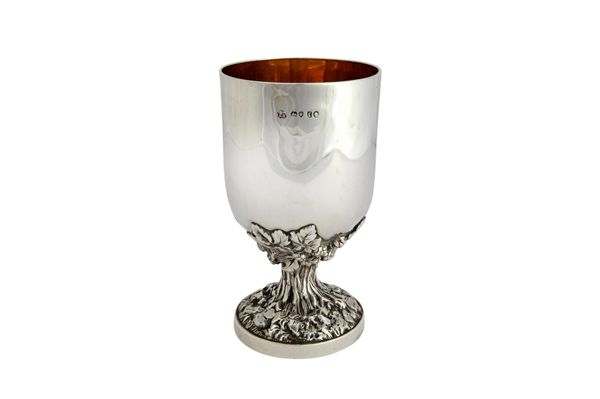 A Victorian silver goblet, the stem supporting the cup cast with foliate and budding motifs, on a circular foot, London 1858, detailed Hunt & Roskell,