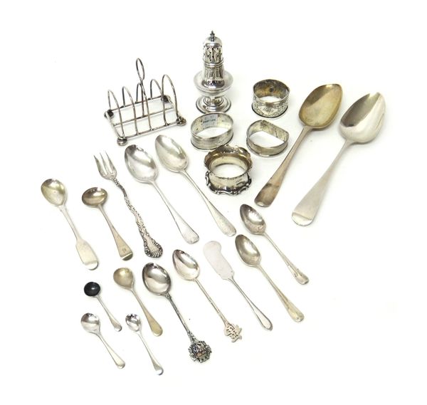 Silver, comprising; a five bar toastrack, a baluster shaped pepperette, four napkin rings, two tablespoons, six condiment spoons, three further spoons