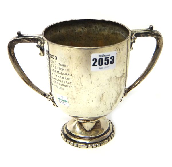 A silver twin handled trophy cup, presentation inscribed, London 1905, weight 444 gms, height 15cm.