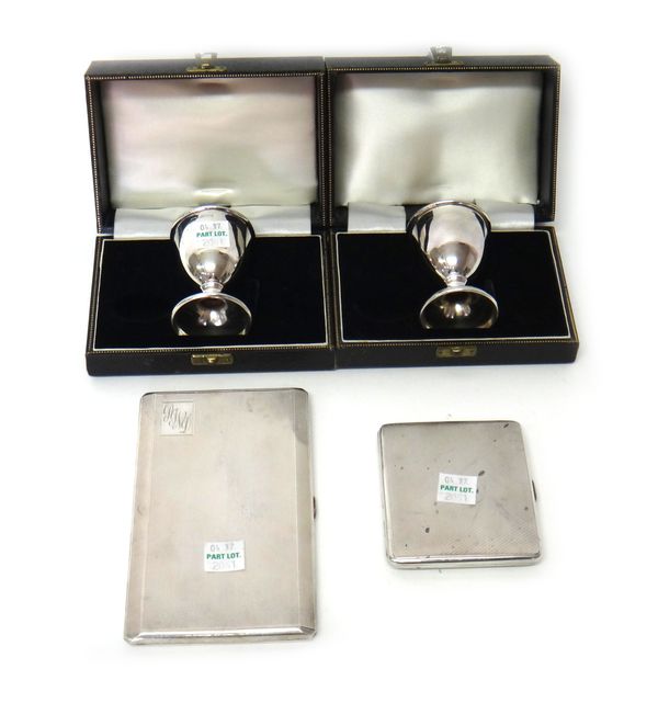 Silver comprising; two egg cups, Birmingham 1957 and 1958, with individual cases, (both lacking spoons), a rectangular cigarette case, with engine tur