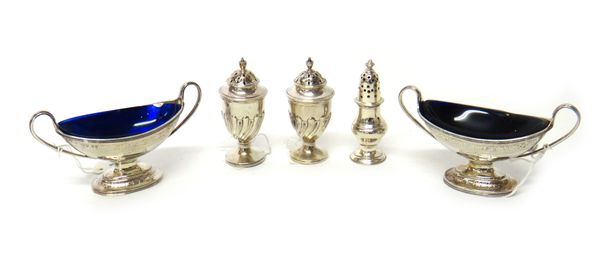 Silver condiments, comprising; a pair of Victorian twin handled salts, of boat shaped form, having engraved decoration, London 1884, with two blue gla