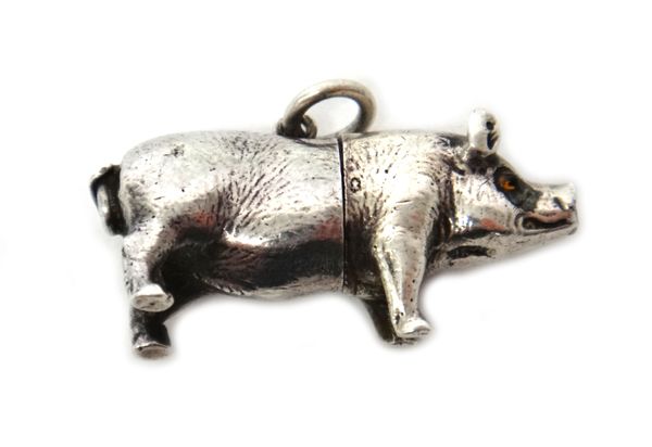 A silver novelty propelling pencil, designed as a standing pig, with paste set eyes, (bears lozenge shaped registration mark), fitted with a suspensio