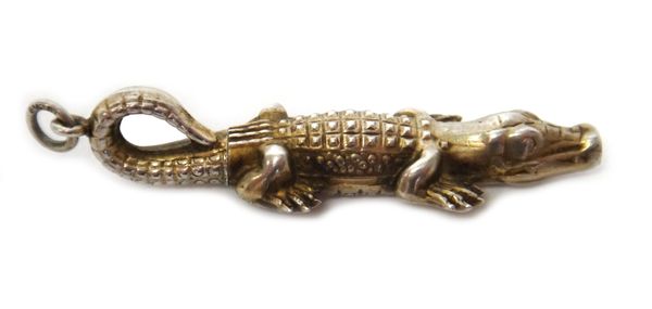 A European gilt novelty propelling pencil, designed as a crocodile, the suspension loop detailed 830.