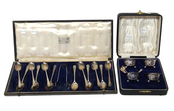 Silver, comprising; a set of twelve rat tail pattern coffee spoons and a pair of matching sugar tongs, London 1938, with a case and a set of four circ