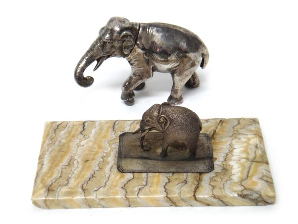 A silver model of a standing elephant, probably Dutch by B. Muller and a smaller model of an elephant, probably Indian mounted on a section of elephan