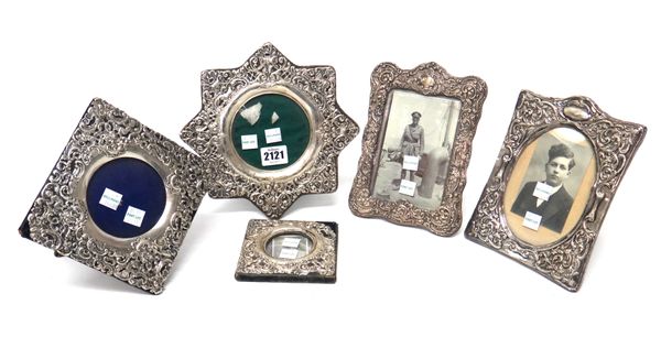 A silver mounted photograph frame, formed as an eight pointed star, with embossed and pierced decoration, Birmingham 1901 and four further silver moun