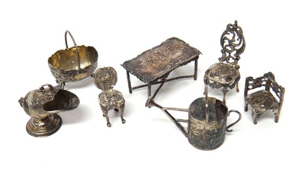 A collection of silver miniatures, comprising; a watering can, a coal scuttle, an oval basket raised on pierced legs, a rectangular table and three ch