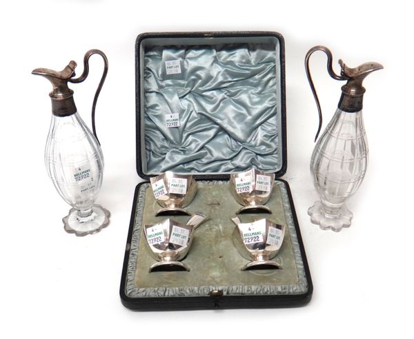 A set of four silver salts, each of hexagonal form and on a circular foot, with three matching salt spoons, all Sheffield 1908, combined weight 144 gm