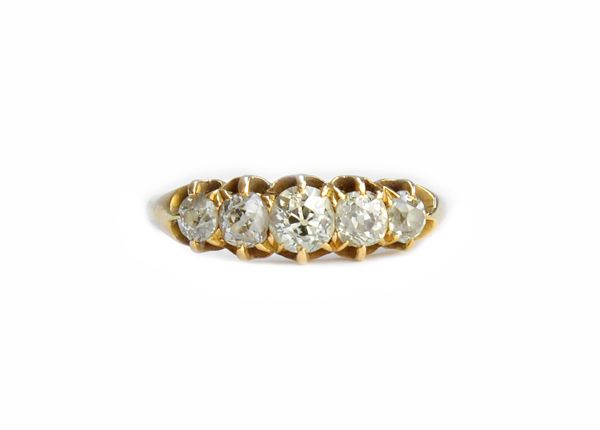 A Victorian 18ct gold and diamond set five stone ring, claw set with a row of cushion shaped diamonds graduating in size to the centre stone, London 1