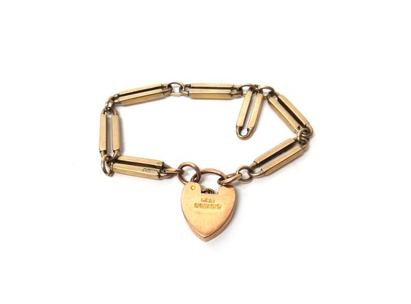 A gold oval and twin bar link bracelet, on a 9ct gold heart shaped padlock clasp, Birmingham 1903, gross weight 10.6 gms.