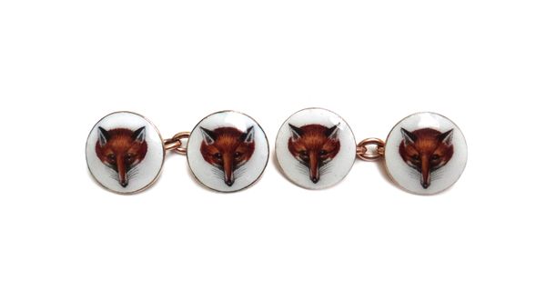 A pair gold and enamelled circular cufflinks, the backs and the fronts enamelled with foxes masks on a white ground, detailed 9, gross weight 7.4 gms