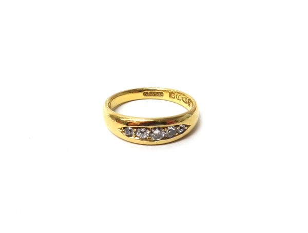 A Victorian 18ct gold and diamond set five stone ring, mounted with a row of circular cut and cushion shaped diamonds graduating in size to the centre