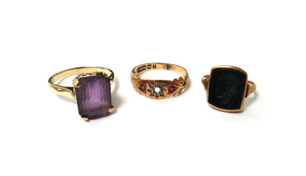 A Victorian 9ct gold, ruby and seed pearl set ring, (one ruby and one seed pearl lacking), Birmingham 1897, a gold and bloodstone set intaglio ring, c