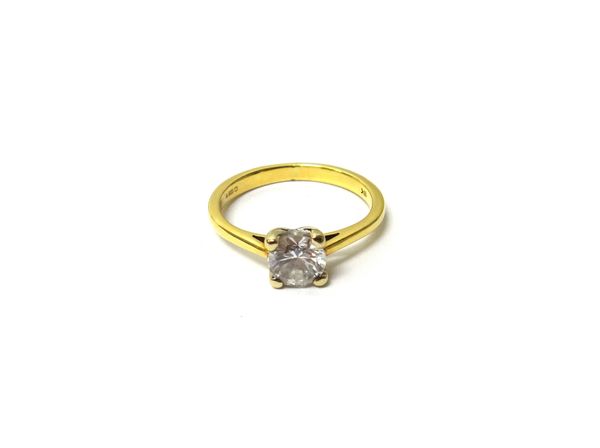 An 18ct gold and diamond set single stone ring, claw set with a circular cut diamond, detailed '18k', the diamond weighs approximately 0.60 cts, ring