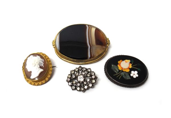 A Victorian gilt metal mounted oval shell cameo brooch, carved as the portrait of a lady, a gilt metal mounted oval banded agate set brooch, an oval F