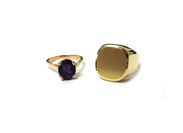 A gentleman's 9ct gold signet ring, having a brushed finish, ring size U, weight 5.6 gms and a 9ct gold ring, claw set with an oval cut amethyst, ring