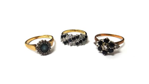 A 9ct gold, diamond and sapphire set cluster ring, a 9ct gold, diamond and pale blue gemstone set oval cluster ring and a 9ct gold, sapphire and colou