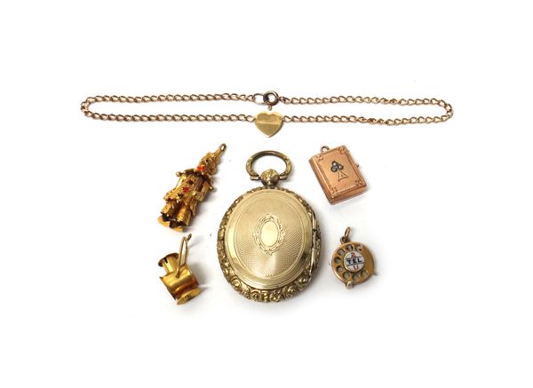 A Victorian oval pendant locket, with engine turned decoration within a moulded border, three 9ct gold charms, comprising; 2 TEL U, a lantern and a cl