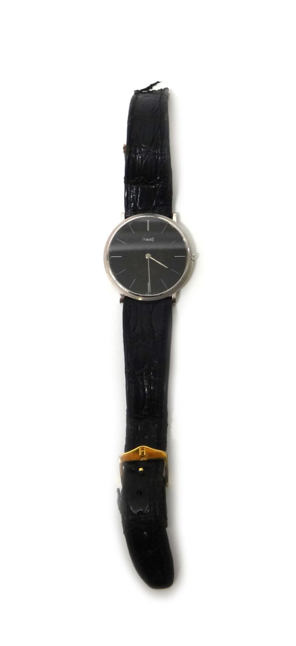 A Piaget gentleman's wristwatch, the signed circular black dial with baton numerals and with plain hands, the case back numbered 9034 169968, with a P