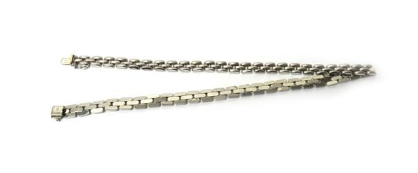 An 18ct white gold necklace, in a three row curved bar link design, on a snap clasp with a foldover safety catch, length 44.5cm, weight 41.8 gms.