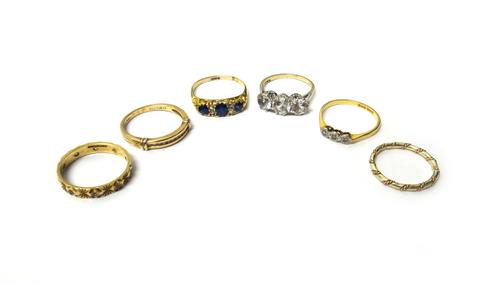 A gold, sapphire, rose diamond and colourless gem set ring, mounted with three oval cut sapphires, three rose cut diamonds and with one colourless gem