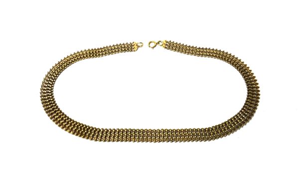 A 9ct gold collar necklace, in a wide interwoven link design, on a boltring clasp, length 40cm, weight 23.1 gms.