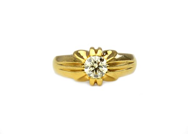 A gold and diamond set single stone ring, claw set with a circular cut diamond, gross weight 9 gms, ring size Q and a half, the diamond weighs approx